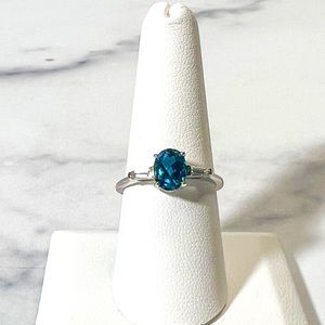 1.32ct Oval London Blue Topaz w/0.17ctw Tapered Baguette White Topaz Sil…